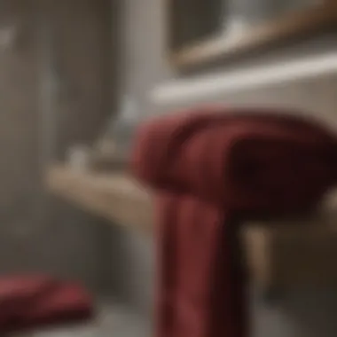 Harmonious Color Pairings Burgundy towels paired with neutral décor elements