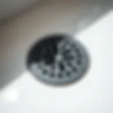 A close-up view of a rubber bathtub drain cover highlighting its texture and design.