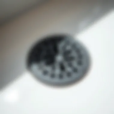 Detailed View of Rubber Drain Cover A close-up view of a rubber bathtub drain cover highlighting its texture and design.