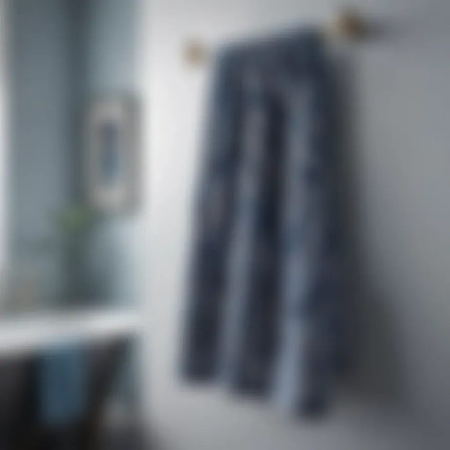Elegant blue paisley bath towel draped on a modern bathroom rack