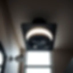 Sleek matte black bathroom exhaust fan with integrated lighting