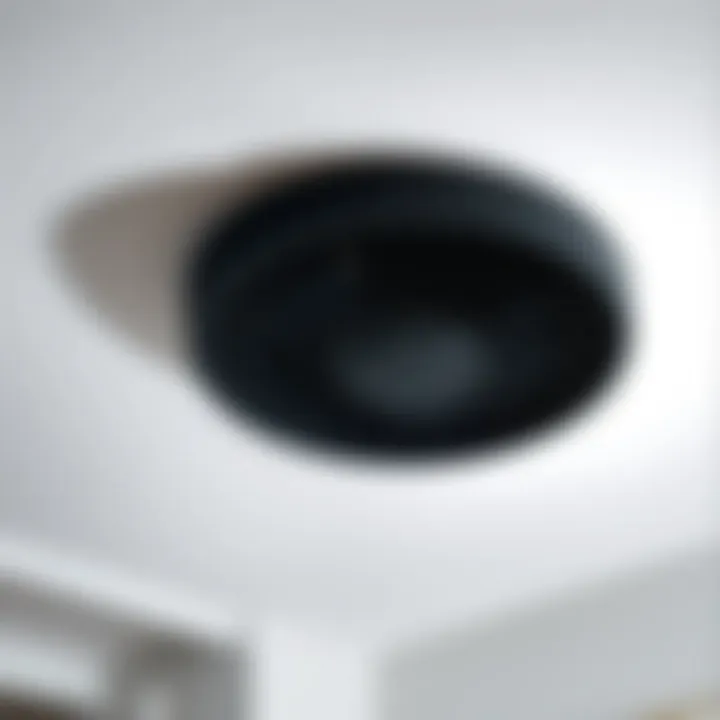 Effortless Installation Showcase Installation of a matte black bathroom exhaust fan with light
