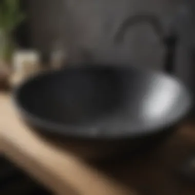 Close-up of a textured black sink bowl highlighting craftsmanship