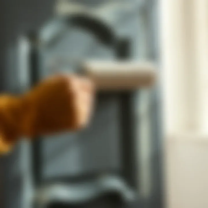 Brush and roller applying paint to a bathroom cabinet