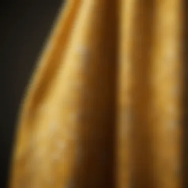 Close-up of intricate yellow patterns on a bath towel, showcasing textile design